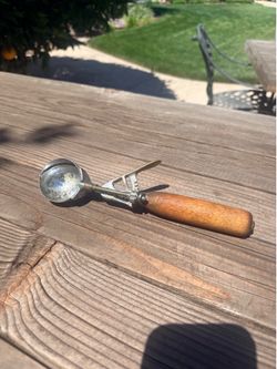 Vintage ice cream scoop with wooden handle