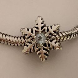 Solid 925 Sterling silver snow flake charm with light blue topaz