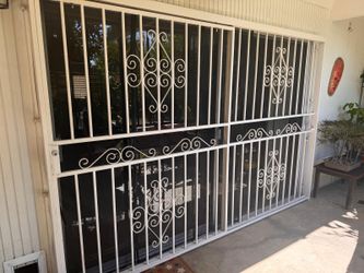 Sliding door and metal guard