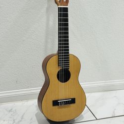 Yamaha GL1 Natural Guitalele Acoustic Guitar Nylon-String  Condition used like new  ( Length Size: 27 inches )