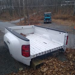 Two 8 foot truck beds. One fits Ford one fits Chevy