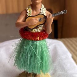 Vintage-style male Hawaiian hula dashboard doll figurine with a ukulele.