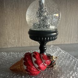 Assortment of Holiday Items (Nutcracker Snow Globe, Blown Or Ament, Collector Santa Coca Cola Glass)