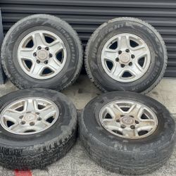 Toyota truck or SUV 6 lug 16 aluminum rims and caps with old tires 