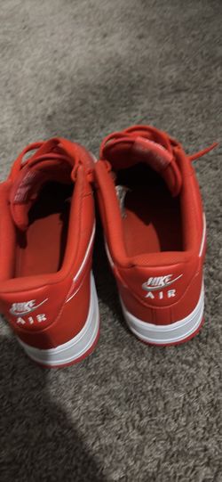 White and orange Air Force Ones