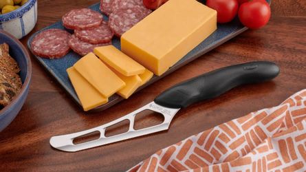 Cutco cheese knife/slicer with comfort grip #1504 - BRAND NEW sealed in bag