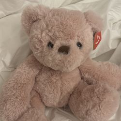 teddy bear doll with original tags attached