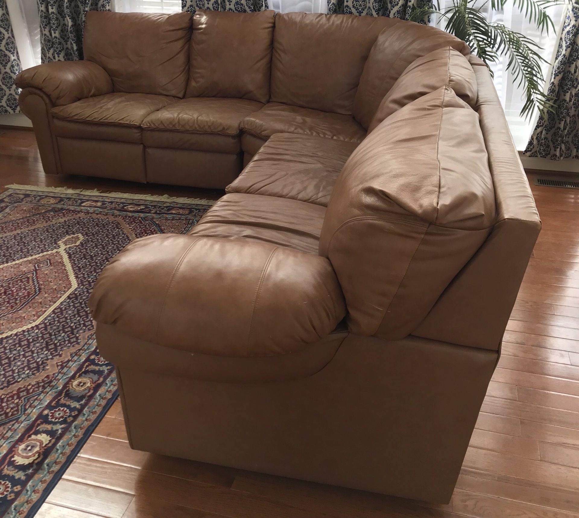 Leather sectional sofa with recliner and pull bed