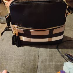 crossbody bag with tassels and plaid pattern