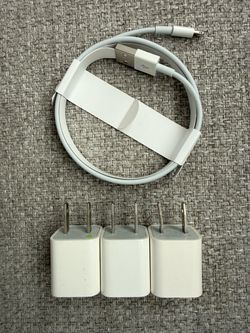 3 Apple USB-A 5 volt charging cubes and 1 USB-A to lightning cable