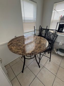 High top table with four chairs High top table with four chairs