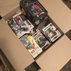 Box of funkos and other toys