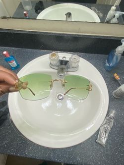 Cartier glasses green lenses