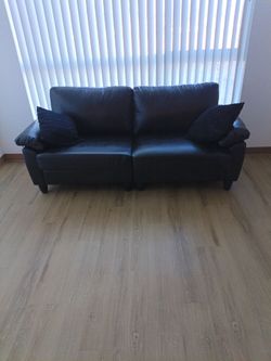 Black Faux Leather Couch with side pockets
