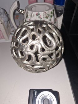 Metal hollow orb sculpture