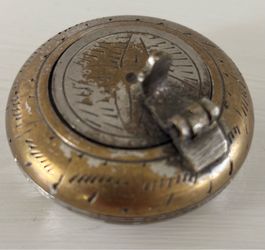 Vintage brass pocket ashtray, specifically a portable, hinged-lid design