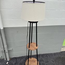 Three legged lamp with white shade post 5 feet and 3 inches tall 