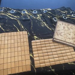 Black /gold curtains & wood table mats