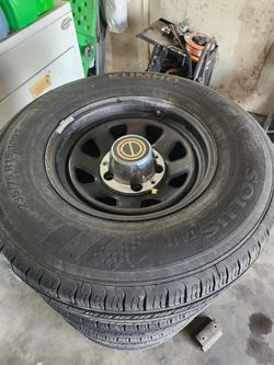 235/75/R15  tires with rims 95% good