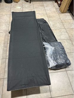 Camping cot with cushion