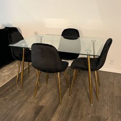 Gold Accent Glass Dining Set with Black Velvet Chairs