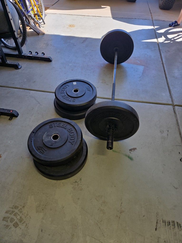 Olympic Bar, Collars, And 6 X 45LB bumpers