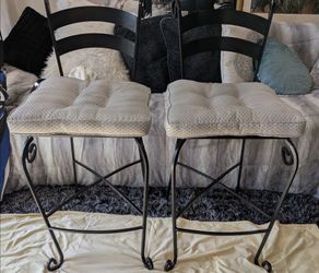 Set of 2. Jay zeltner wrought iron bar height chairs.