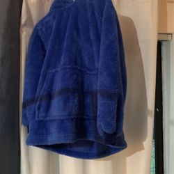 It’s a children’s, medium, small, hooded, warm rolls into a ball.