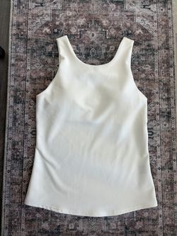 Cream sleeveless blouse
