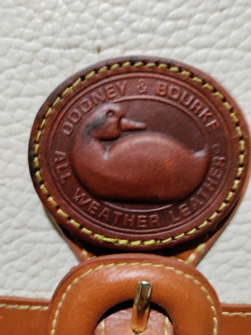 Dooney & Bourke Creme And Tan Pebbled All Weather Leather Purse
