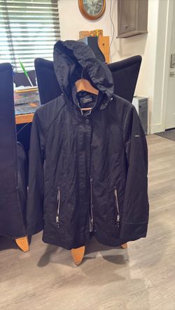 Black womens Gina tricot hooded raincoat front zipper hidden by a button -down placket . Size S.