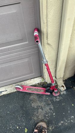 Pink child’s razor scooter