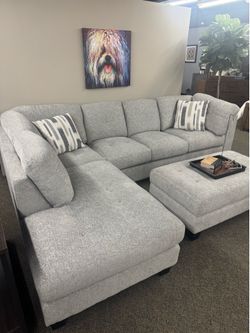 COSTCO Gray chenille sectional couch and ottoman