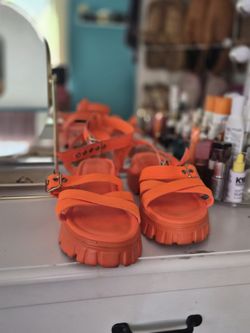 Orange platform sandals with chunky sole
