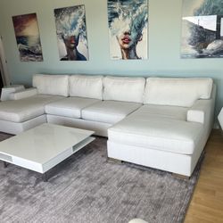 Large Double chase , ivory, white upholstered, couch +2 end tables and matching high glass white table