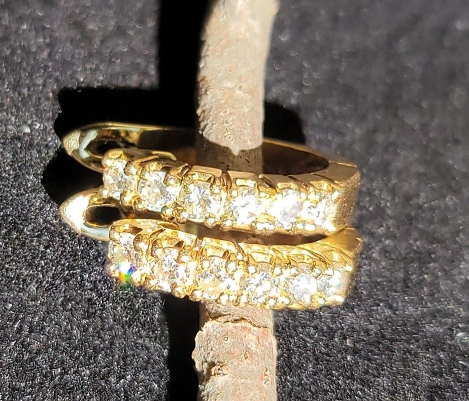 Pair of 14kt yellow gold diamond earrings