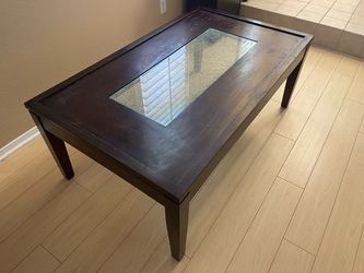 living room coffee table with decor glass in middle