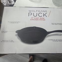Wolfgang Puck 11" Cast Iron Chicken Fryer features a pre-seasoned surface suitable for all cooking surfaces, including induction, and is oven safe up 