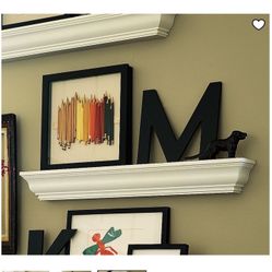 4 white solid wood Pottery Barn floating shelves with crown molding detailing