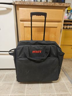 Pfaff sewing machine rolling travel bag with a telescope handle