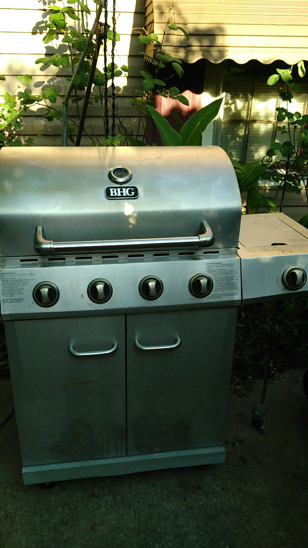 65 large bhg stainless steel gas grill 4 burner plus side burner works great and no problems without tank