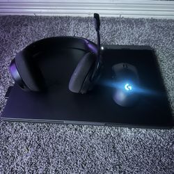 ROG Strix G16 2024 gaming laptop with gaming headset and mouse