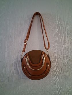 Round, brown purse