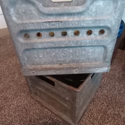 2 Antique 1967 metal milk crates