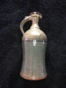 Beautiful sculpted Clay vase signed
