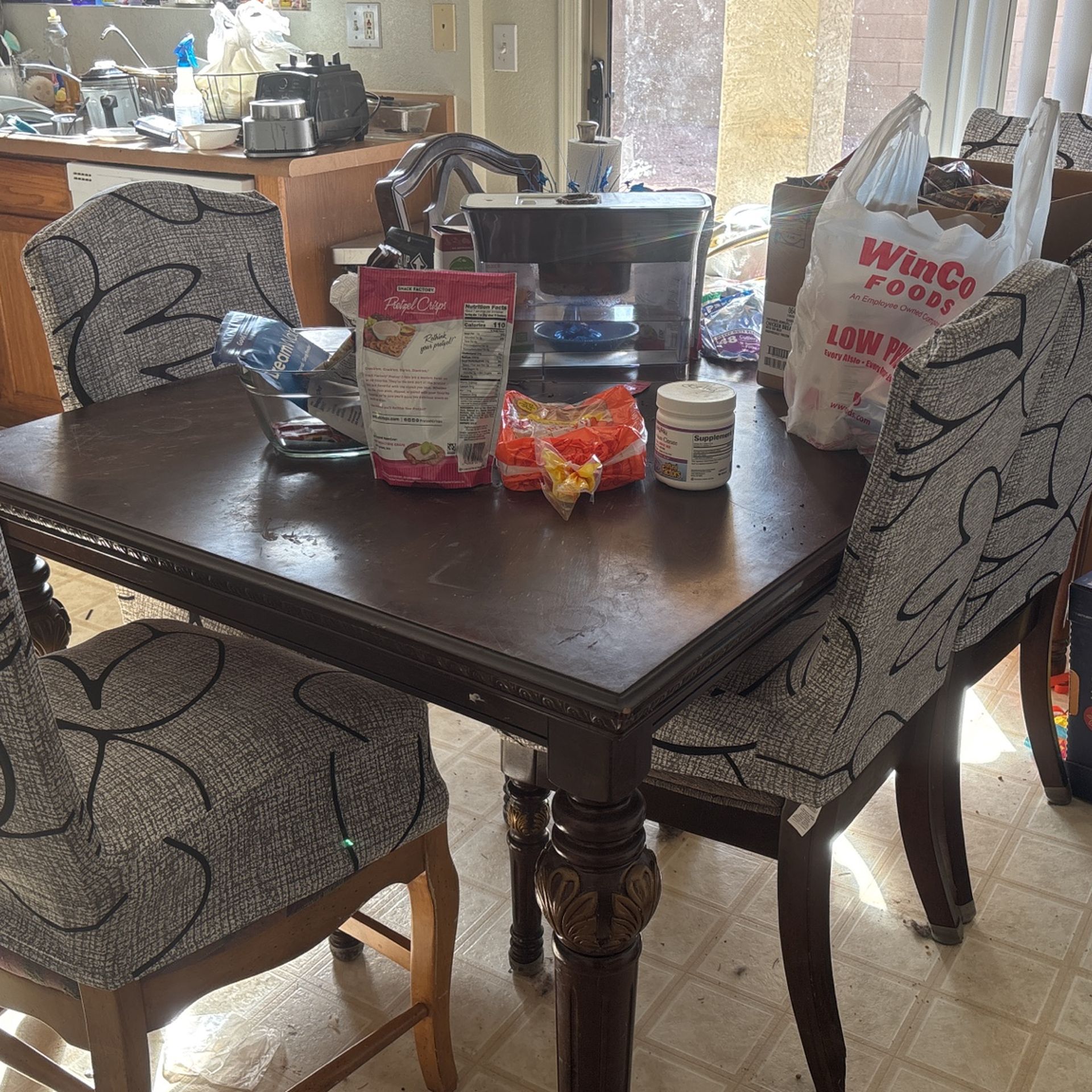 Large family size solid wood dining table with extended leaf attachment from Ashley furniture has some ware and tear but in good condition