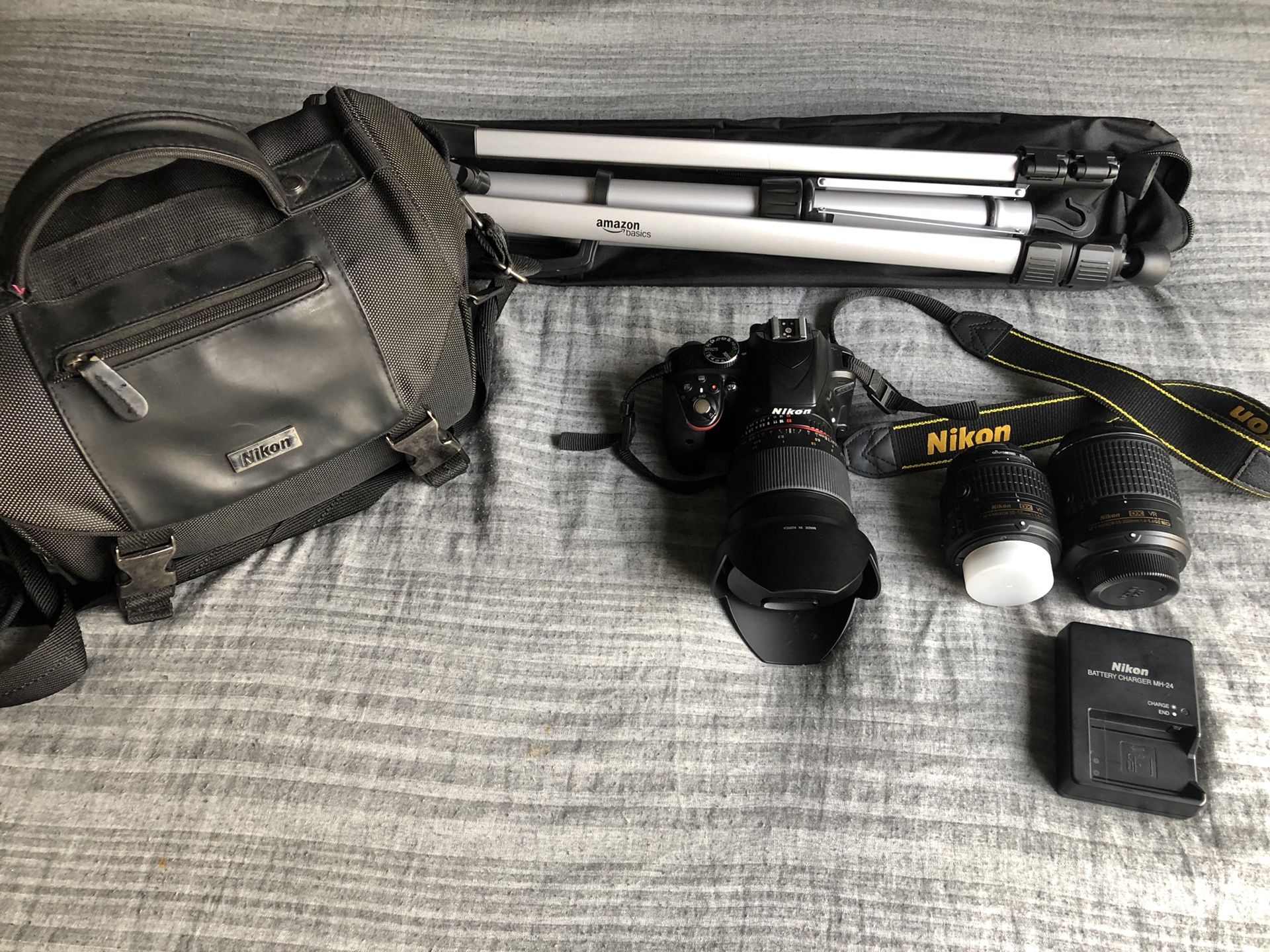 Nikon D3300 + 3 lenses, tripod, 64 gb card, & camera bag