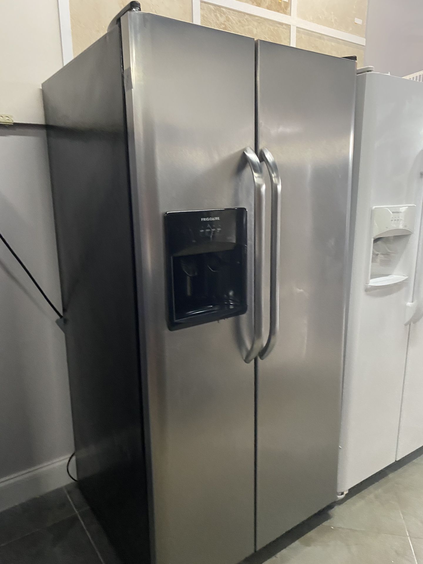 Frigidaire stainless steel refrigerator 33” wide in perfect condition and 3 months warranty. We have delivery service available