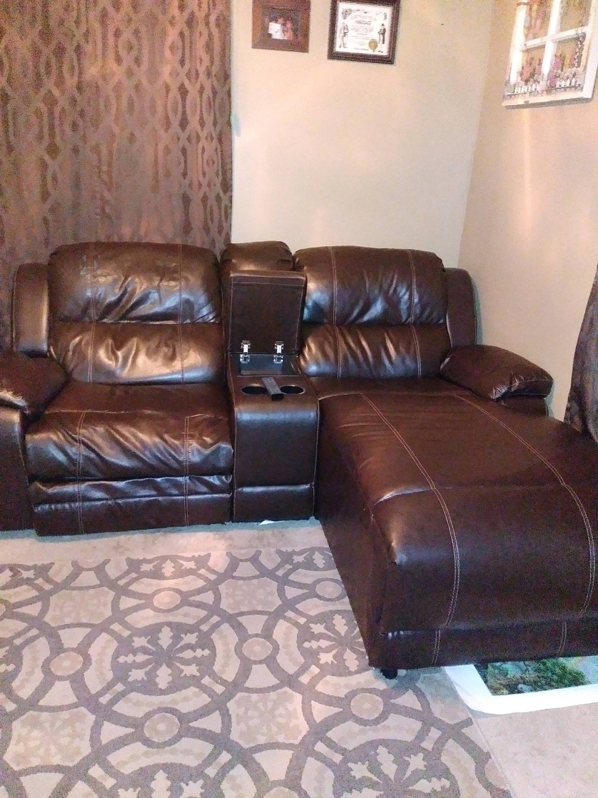 Brown leather reclining sectional with cup holders
