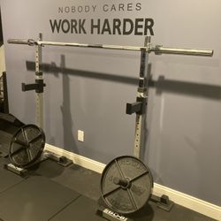 Pair Of Independent Squat Stands And A New 7’ Olympic Barbell 